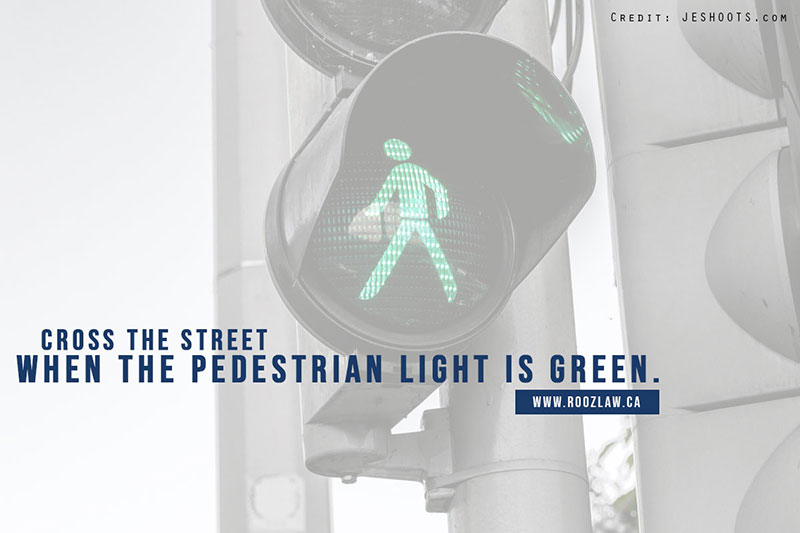 Cross the street when the pedestrian light is green.