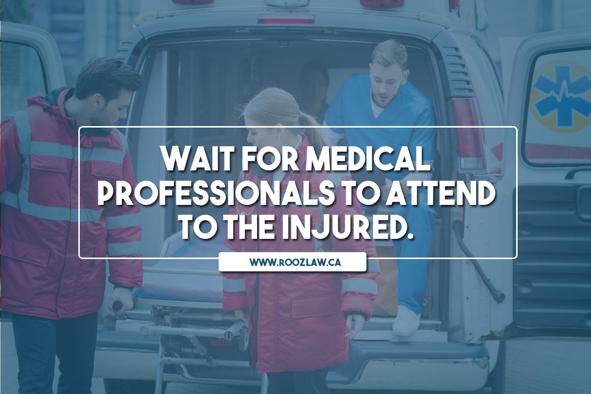 Wait for medical professionals to attend to the injured.